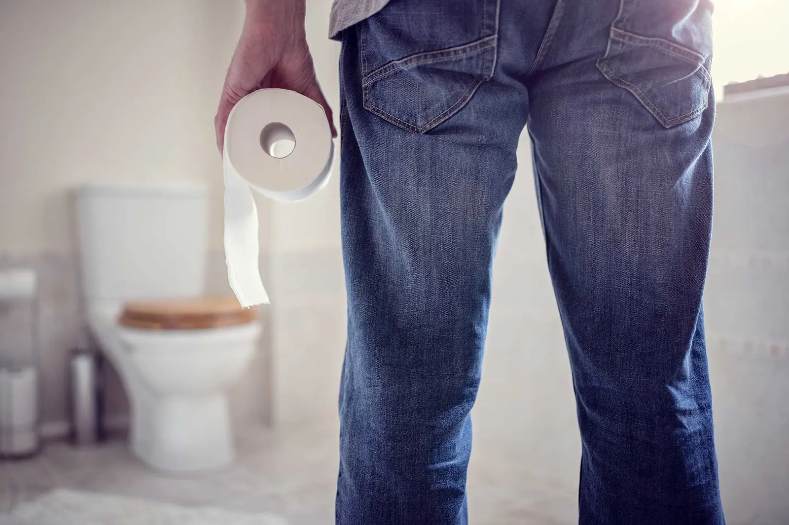 Toilet paper beside a bathroom fixture