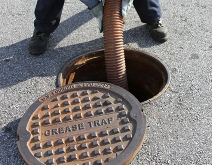 Open grease trap at a commercial property